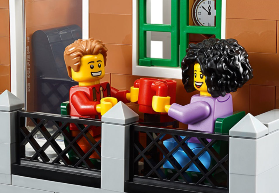 Two LEGO minifigs having a coffee on the balcony